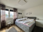 Schlafzimmer - Vielseitiges Wohn-/Geschäftshaus – Ihre Chance auf ein attraktives Investment!