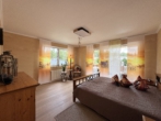 Schlafzimmer OG - Vielseitiges Wohn-/Geschäftshaus – Ihre Chance auf ein attraktives Investment!