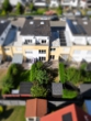 Haus Rückansicht - Drei Etagen voller Wohnkomfort – modern, hell und energieeffizient