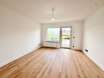 Wohnzimmer - Frisch saniert, modern ausgestattet – 3-Zimmer-Wohnung mit Balkon