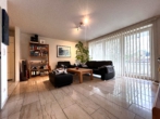 Wohnzimmer - Freundliche 2-Zimmerwohnung mit geräumigem Balkon in Voxtrup