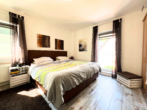 Schlafzimmer DG - Zuhause mit Herz – Mehrgenerationenhaus in traumhafter Lage