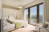 Schlafzimmer - Zentrale 2-Zimmer-Neubauwohnung mit sonniger Dachterrasse