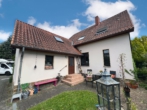 Hausansicht Garten - Wohnen am Mittellandkanal – Zweifamilienhaus mit potential