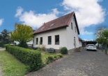 Hausansicht seitlich - Wohnen am Mittellandkanal – Zweifamilienhaus mit potential