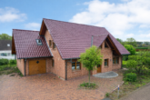Außenansicht - Charmantes Familienhaus mit Gartenidylle und vielseitigen Nutzungsmöglichkeiten