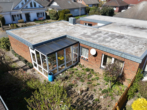 Rückansicht - Größer als gedacht! Bungalow mit Wintergarten in Vechta